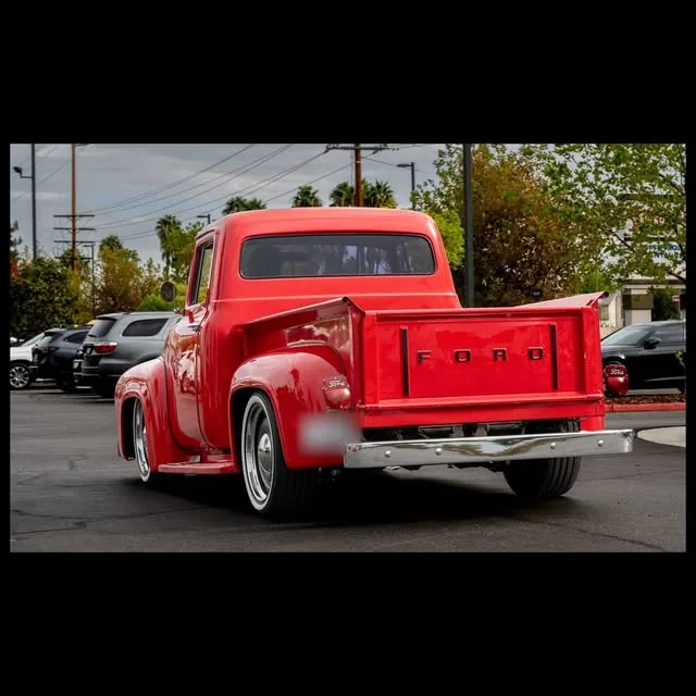 Red classic Ford pickup.
